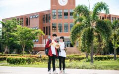 Male and female students wear a face Chill and stand in front of
