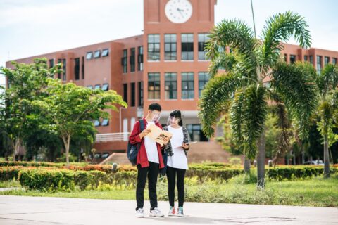 Male and female students wear a face Chill and stand in front of