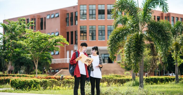 Male and female students wear a face Chill and stand in front of